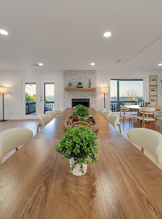 Dining — stone fireplace and lake view