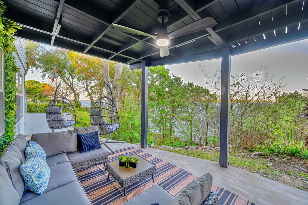 Covered porch — egg chairs over the lake